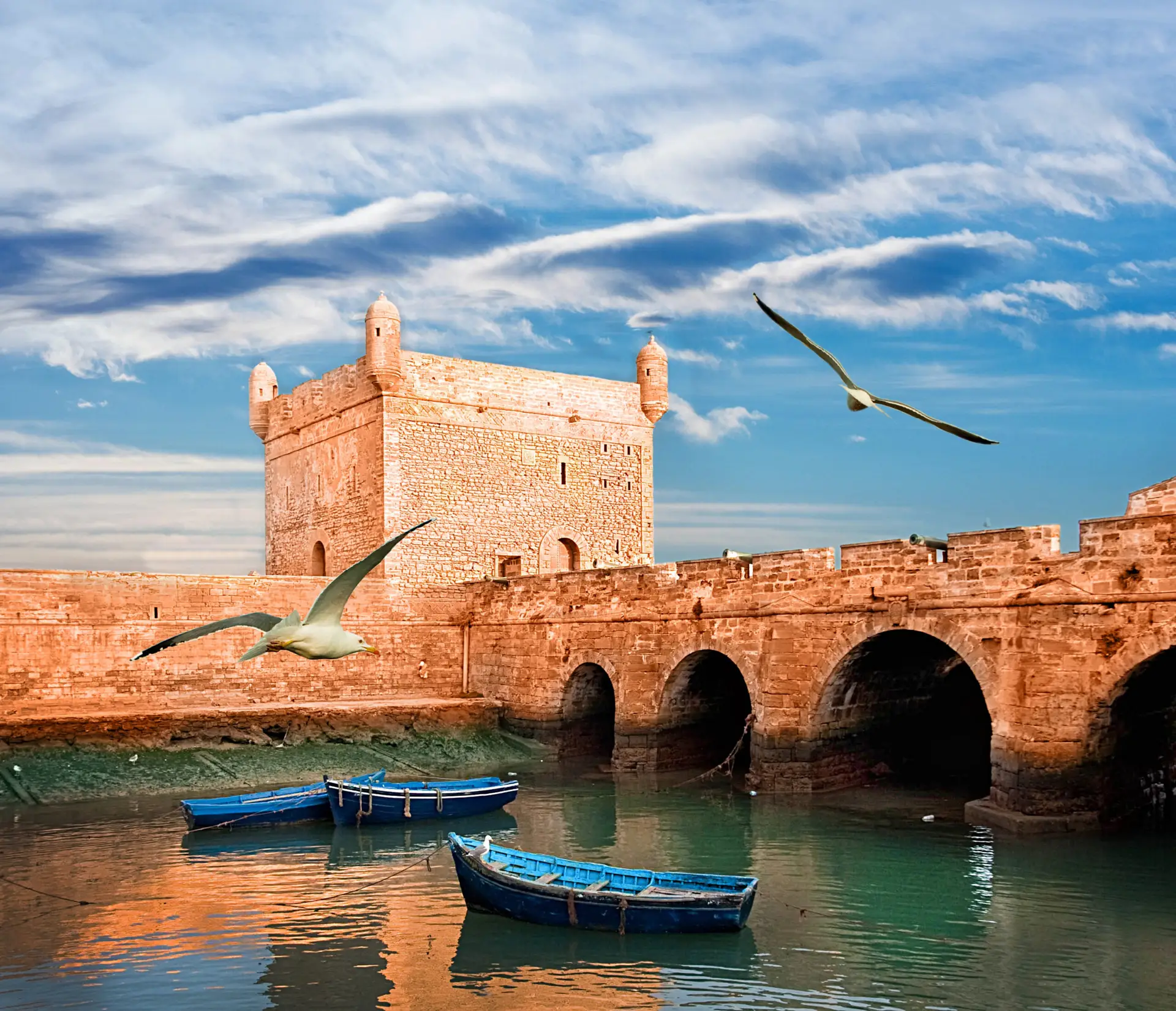 The historic city walls of Essaouira overlooking the harbor in Morocco.