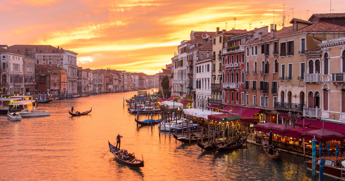 Grand Canal of Venice with a gondola at sunset